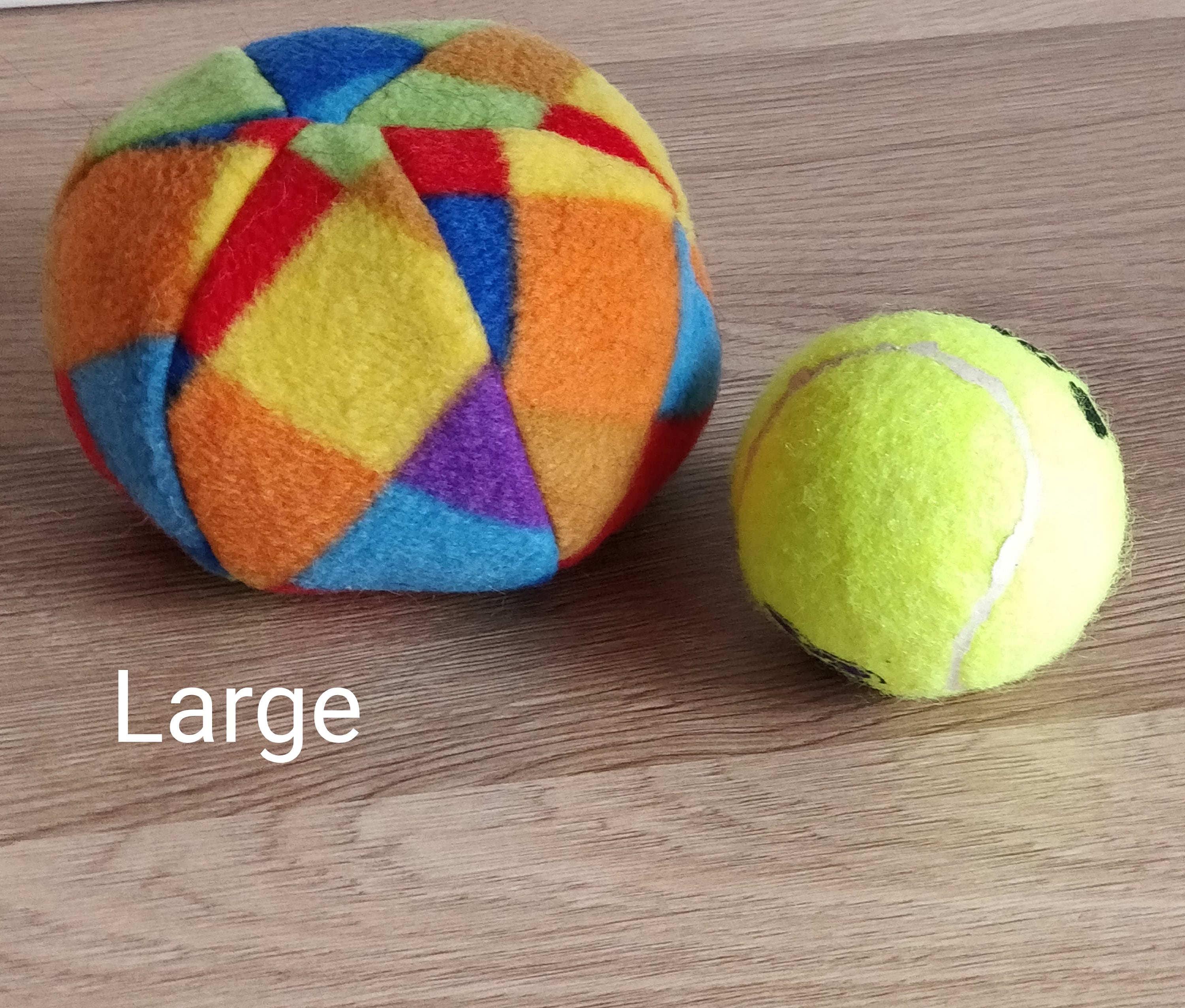 Soft fleece dog ball, pet toy with sheepskin stuffing, squeaker option available. Wool ball