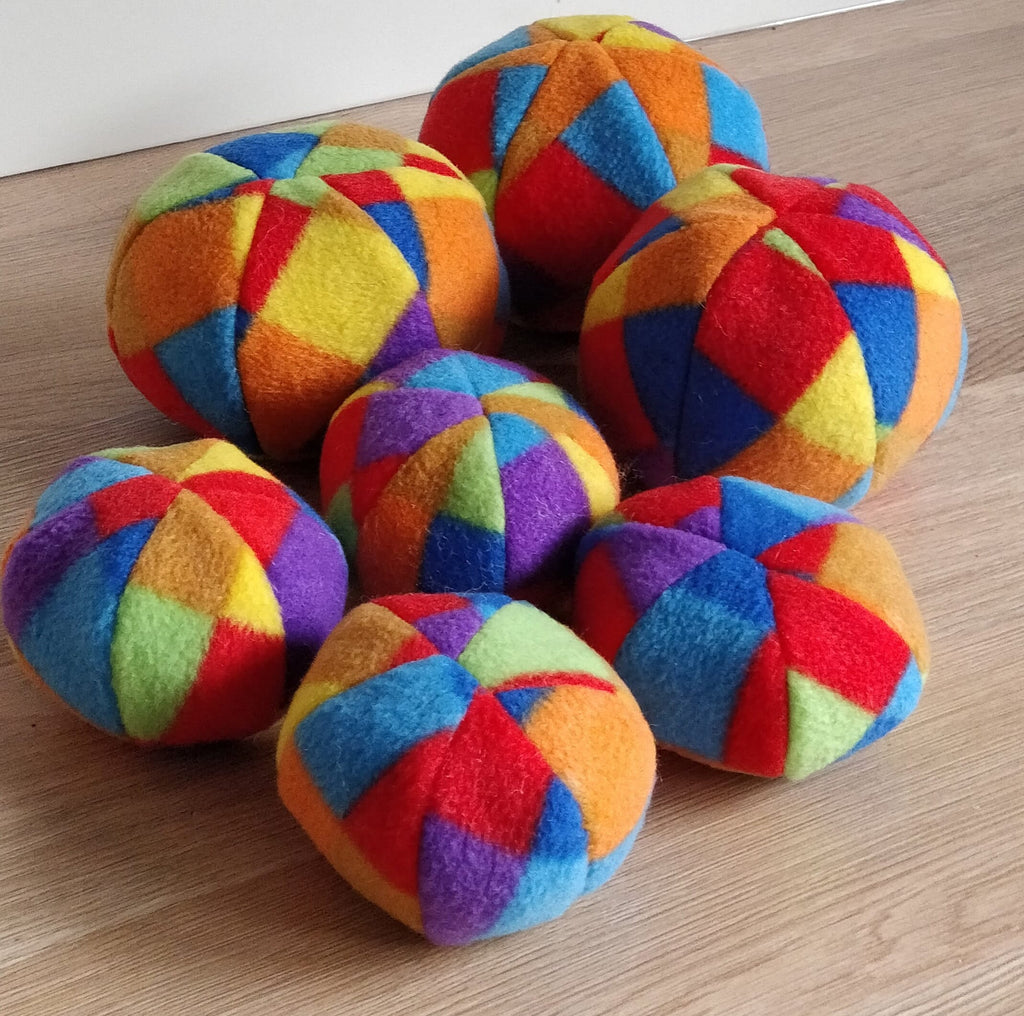 Soft fleece dog ball, pet toy with sheepskin stuffing, squeaker option available. Wool ball