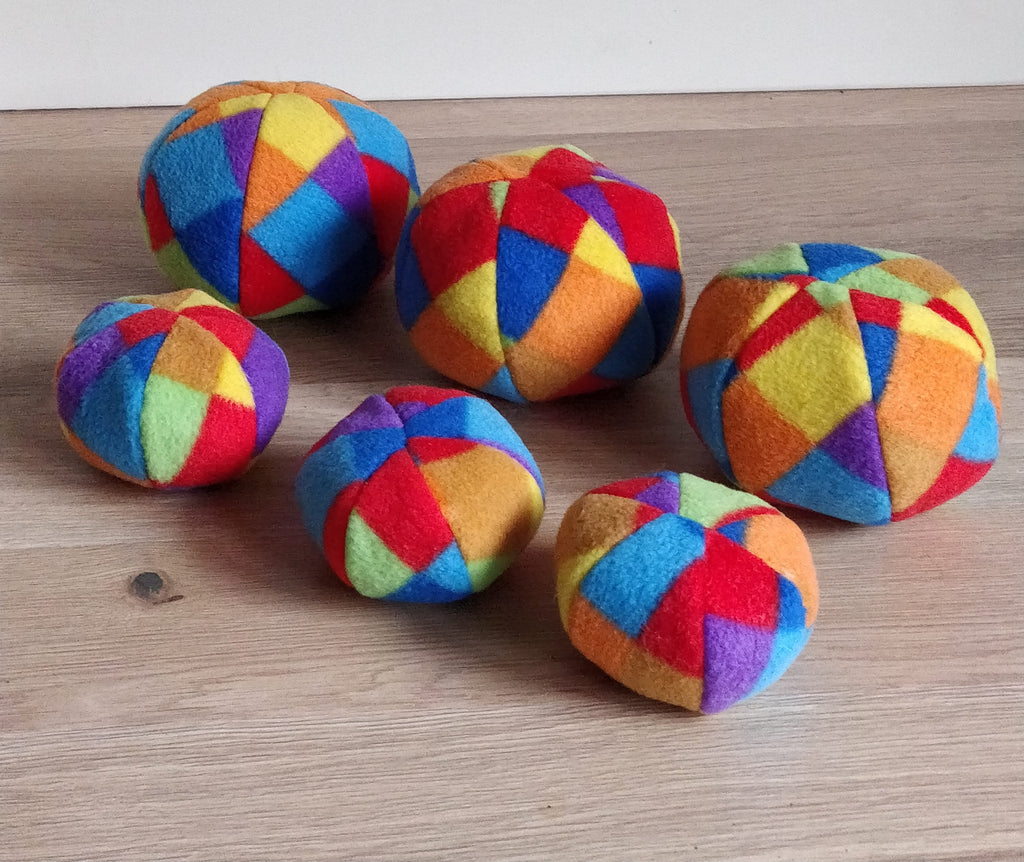 Soft fleece dog ball, pet toy with sheepskin stuffing, squeaker option available. Wool ball