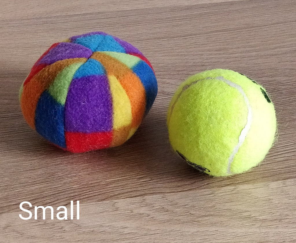 Soft fleece dog ball, pet toy with sheepskin stuffing, squeaker option available. Wool ball