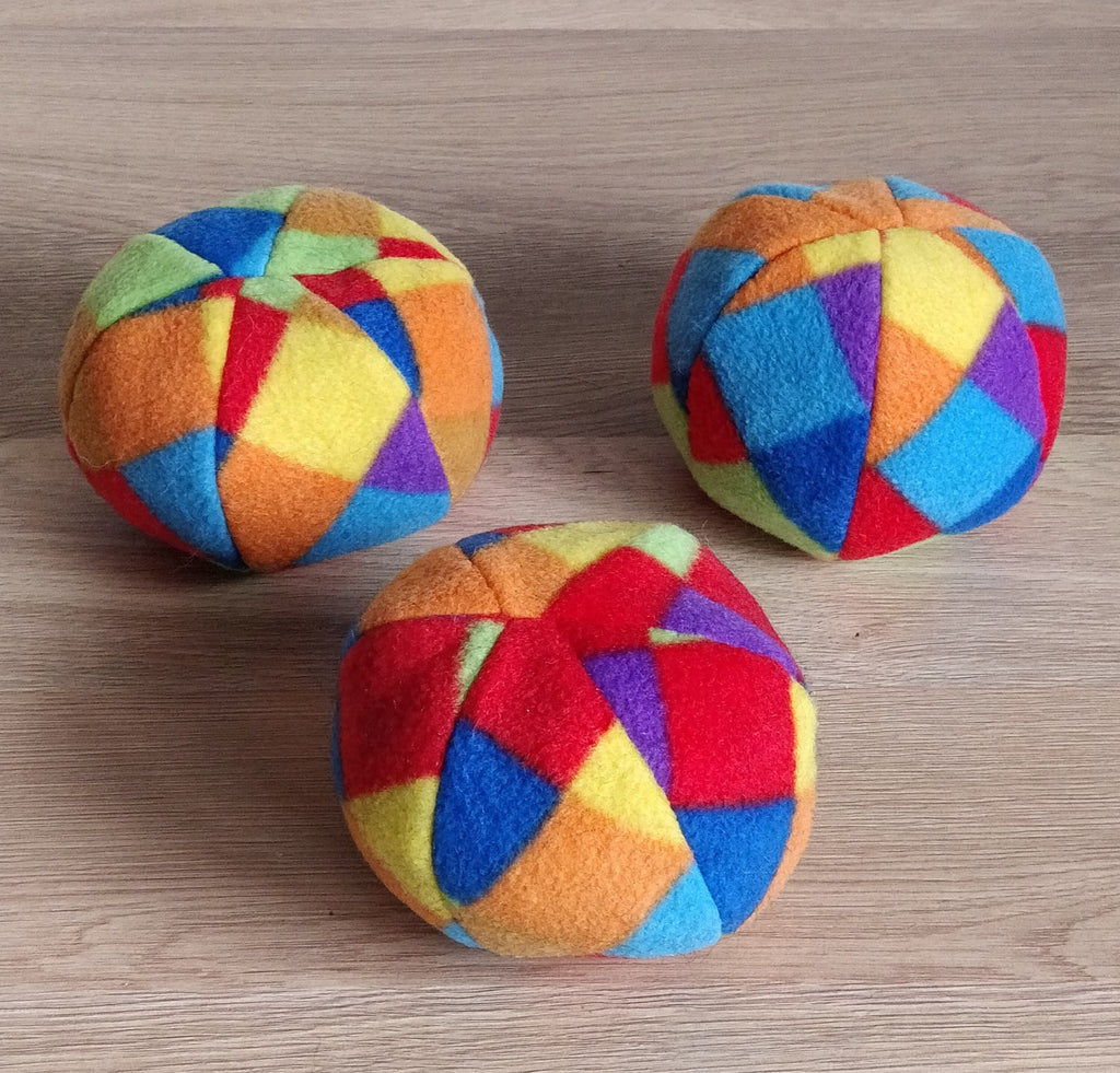Soft fleece dog ball, pet toy with sheepskin stuffing, squeaker option available. Wool ball