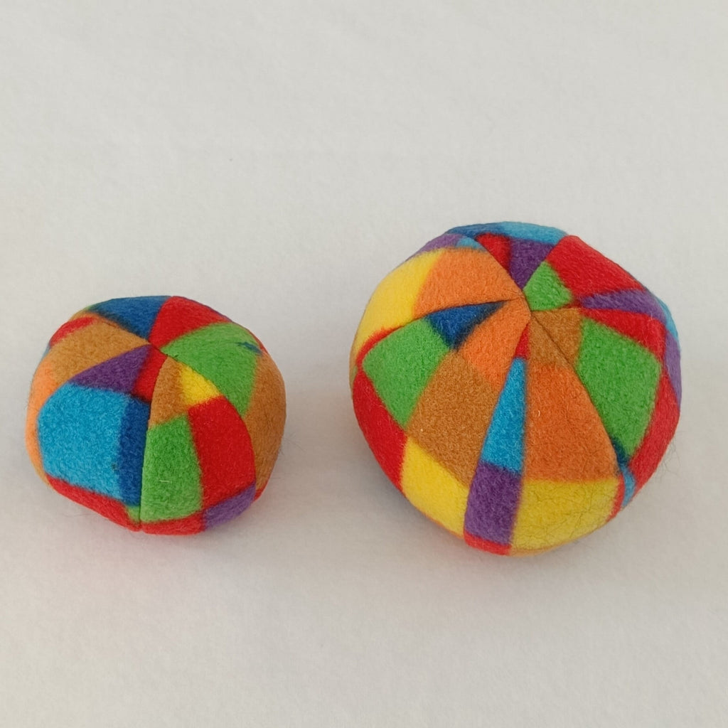 Soft fleece dog ball, pet toy with sheepskin stuffing, squeaker option available. Wool ball