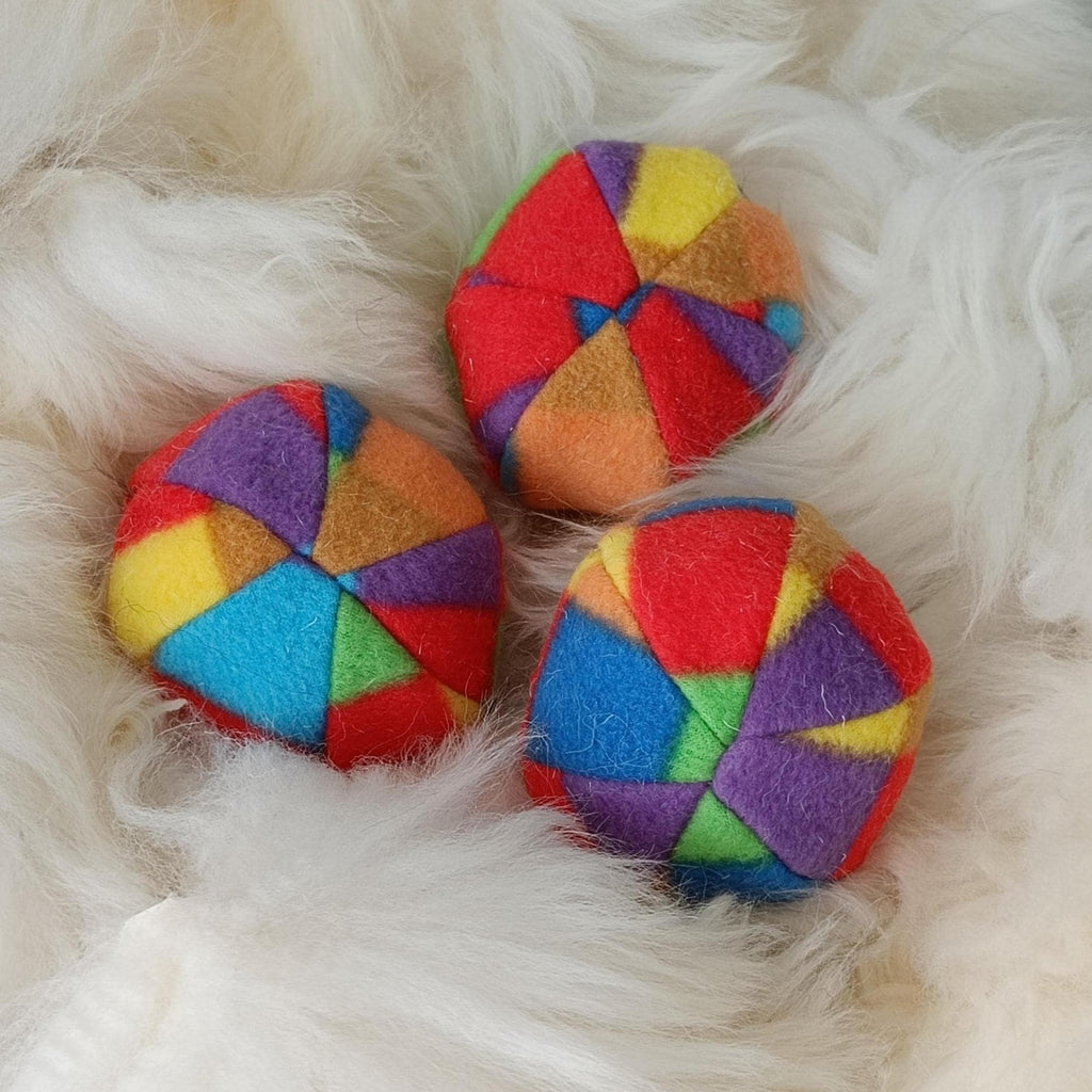 Soft fleece dog ball, pet toy with sheepskin stuffing, squeaker option available. Wool ball