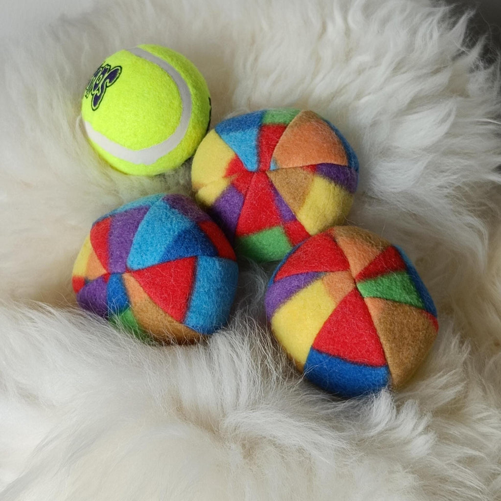 Soft fleece dog ball, pet toy with sheepskin stuffing, squeaker option available. Wool ball