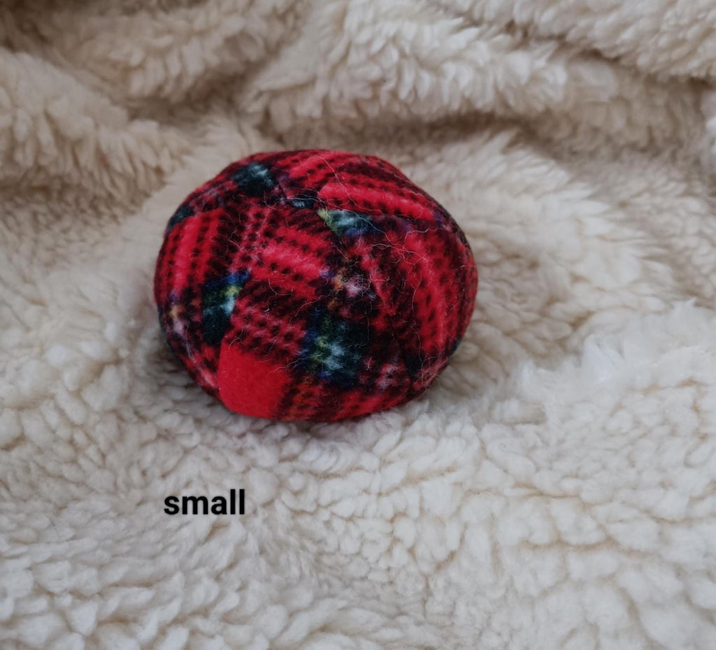 Soft fleece dog ball, pet toy with sheepskin stuffing, squeaker option available. Wool ball