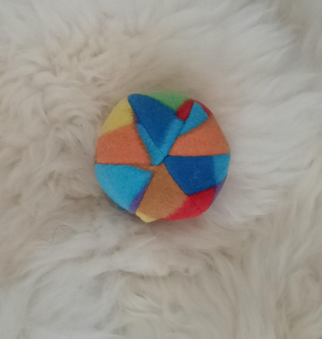 Soft fleece dog ball, pet toy with sheepskin stuffing, squeaker option available. Wool ball