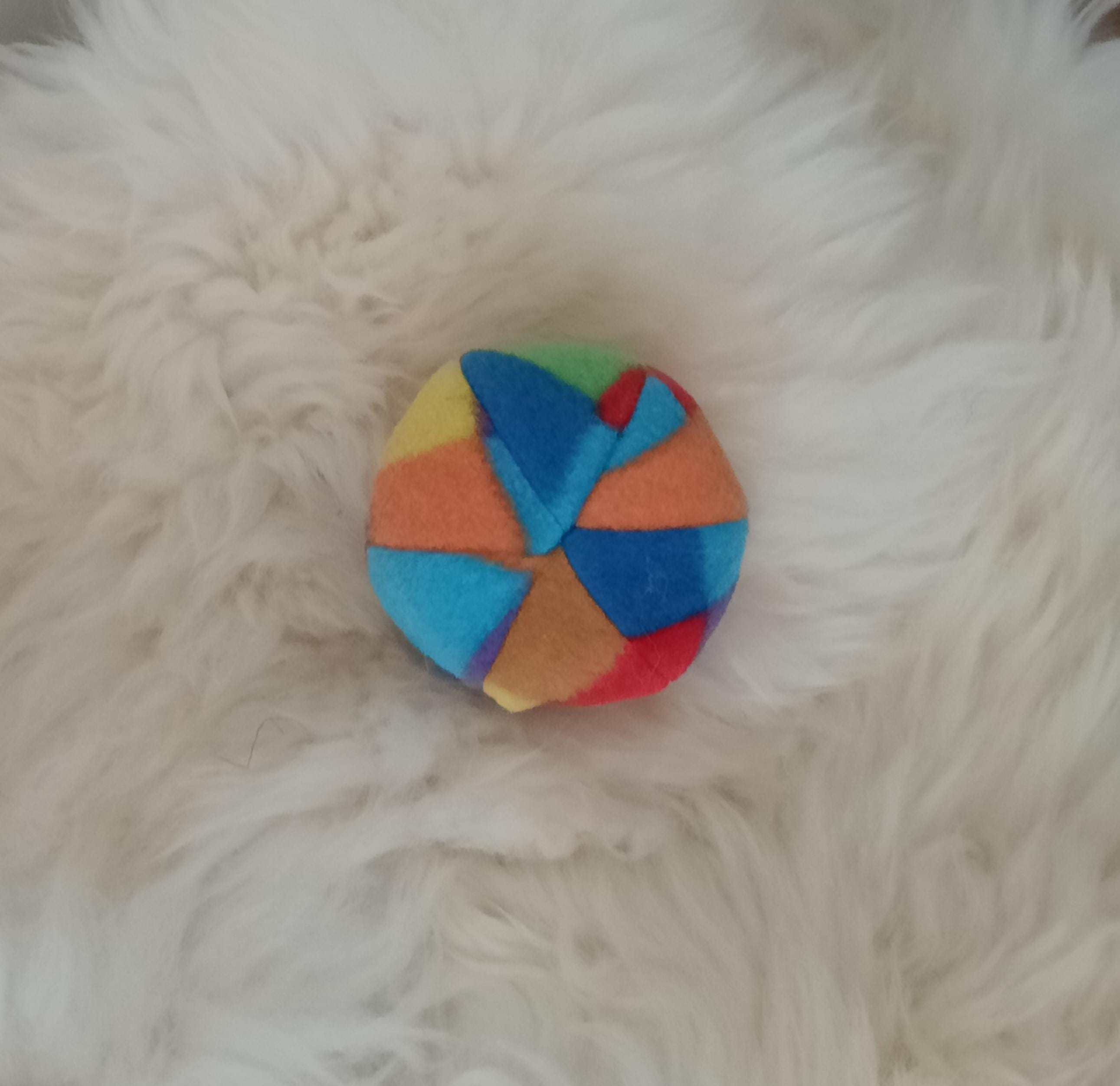 Soft fleece dog ball, pet toy with sheepskin stuffing, squeaker option available. Wool ball