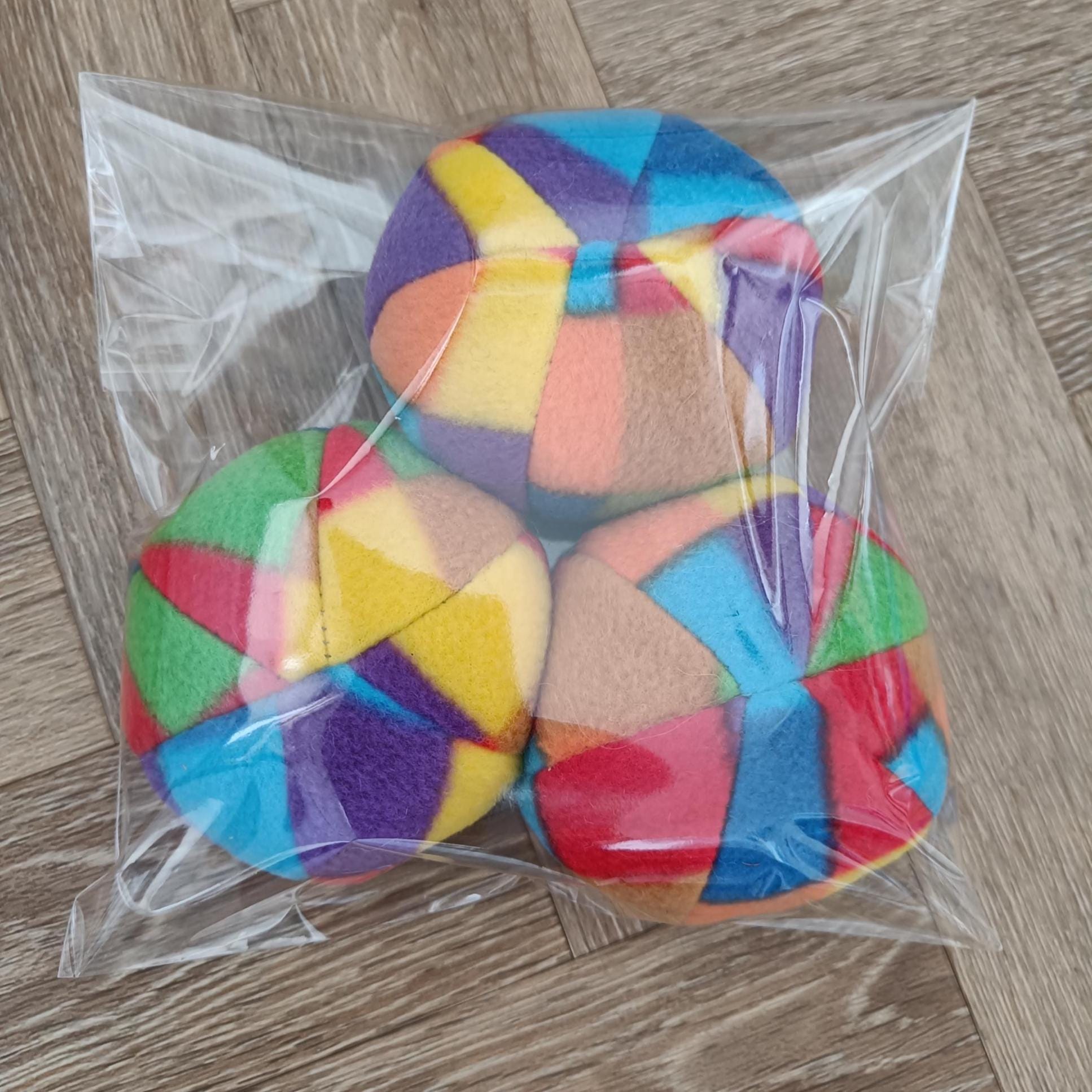 Soft fleece dog ball, pet toy with sheepskin stuffing, squeaker option available. Wool ball